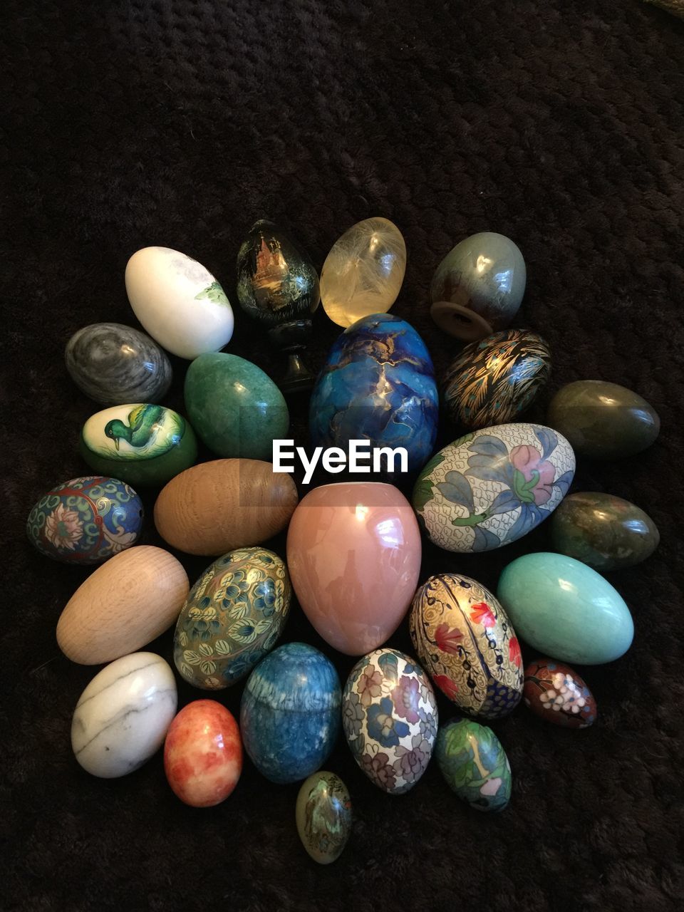 High angle view of multi colored eggs on table