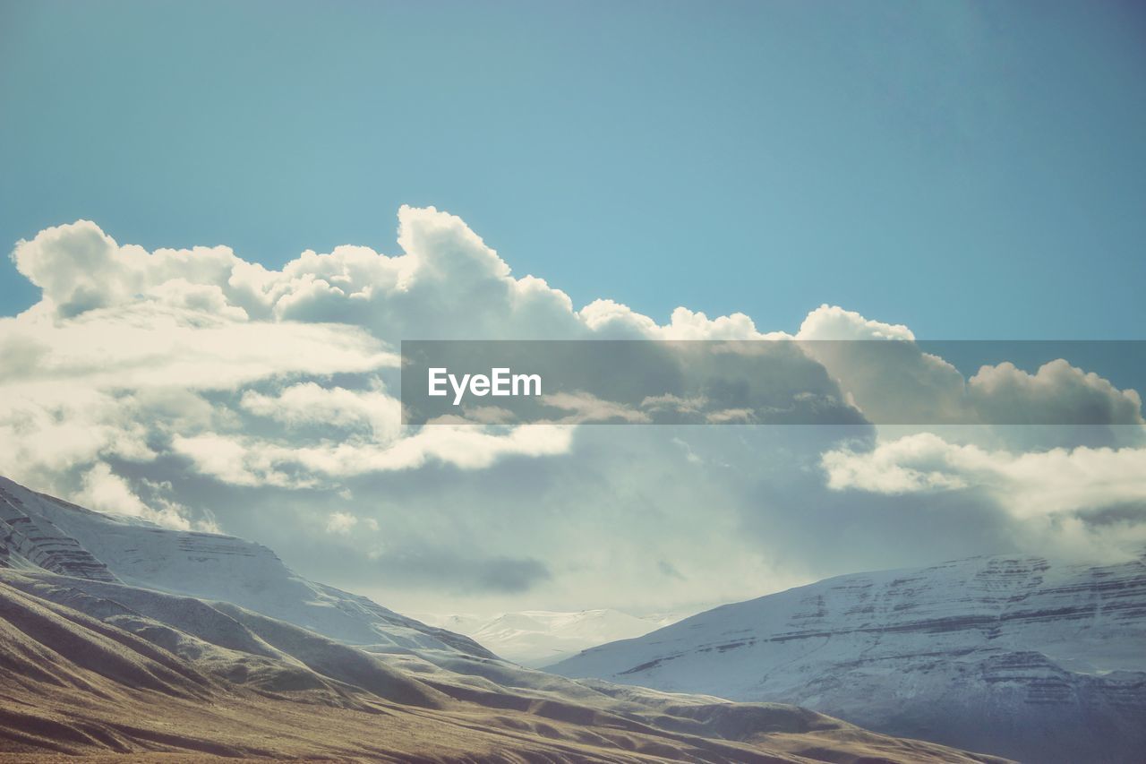 Scenic view of snowcapped mountains against sky