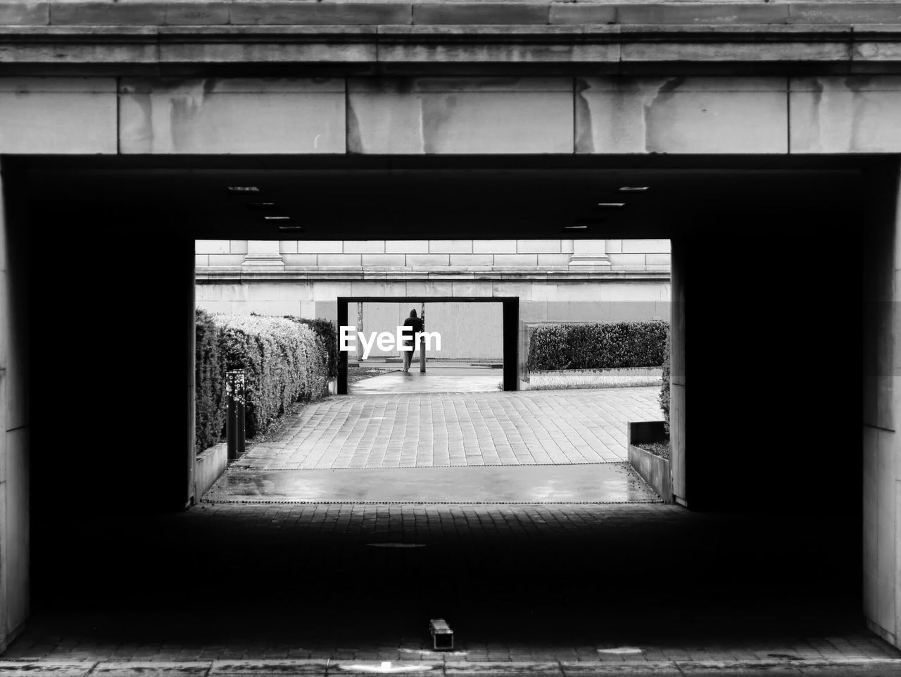 Silhouette of man in tunnel