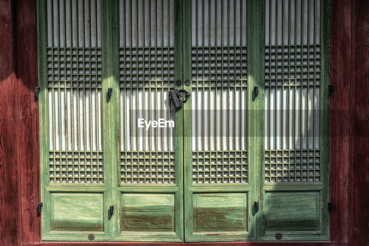 A small door with a lock in changdeokgung palace in seoul, south korea