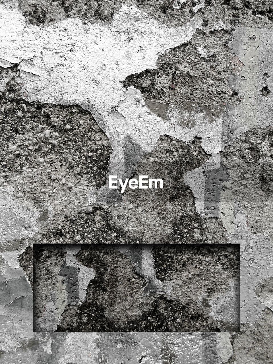 Old weathered concrete wall background with carved frame rectangle