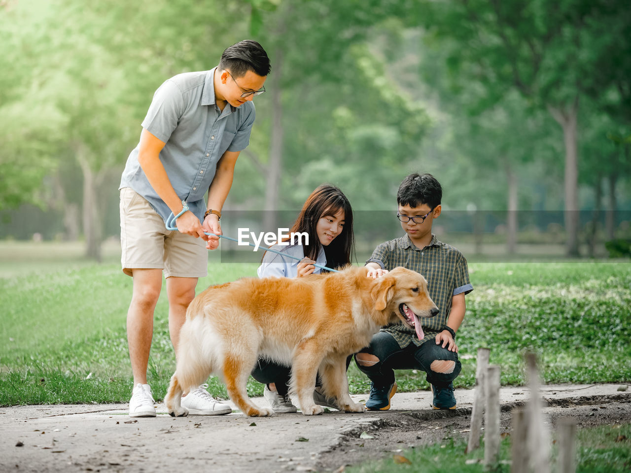 Family with dog at park