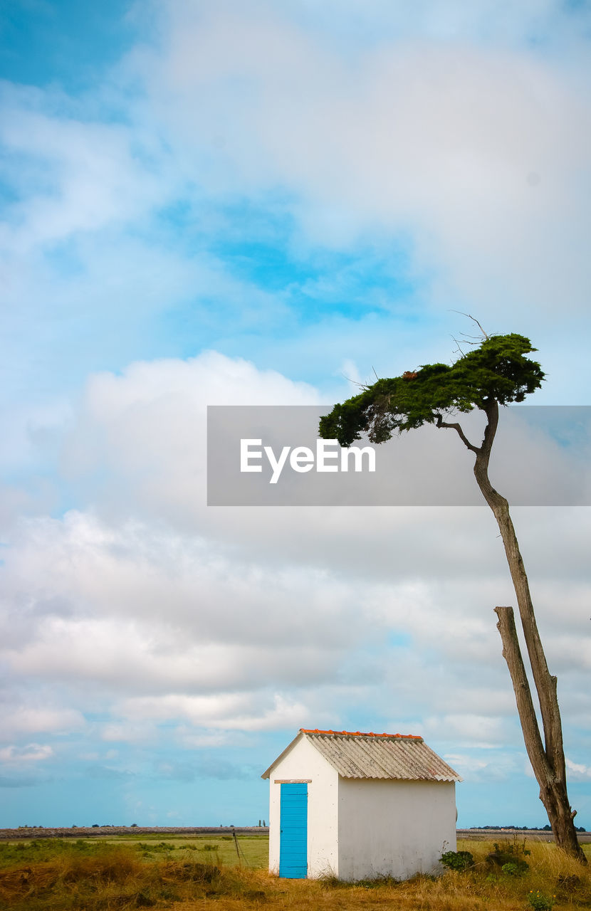 House on field against sky