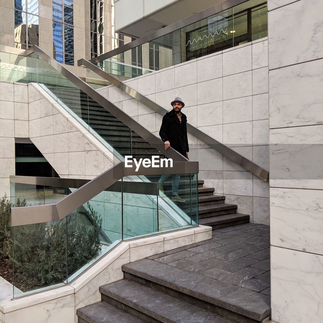 Man on staircase of modern building