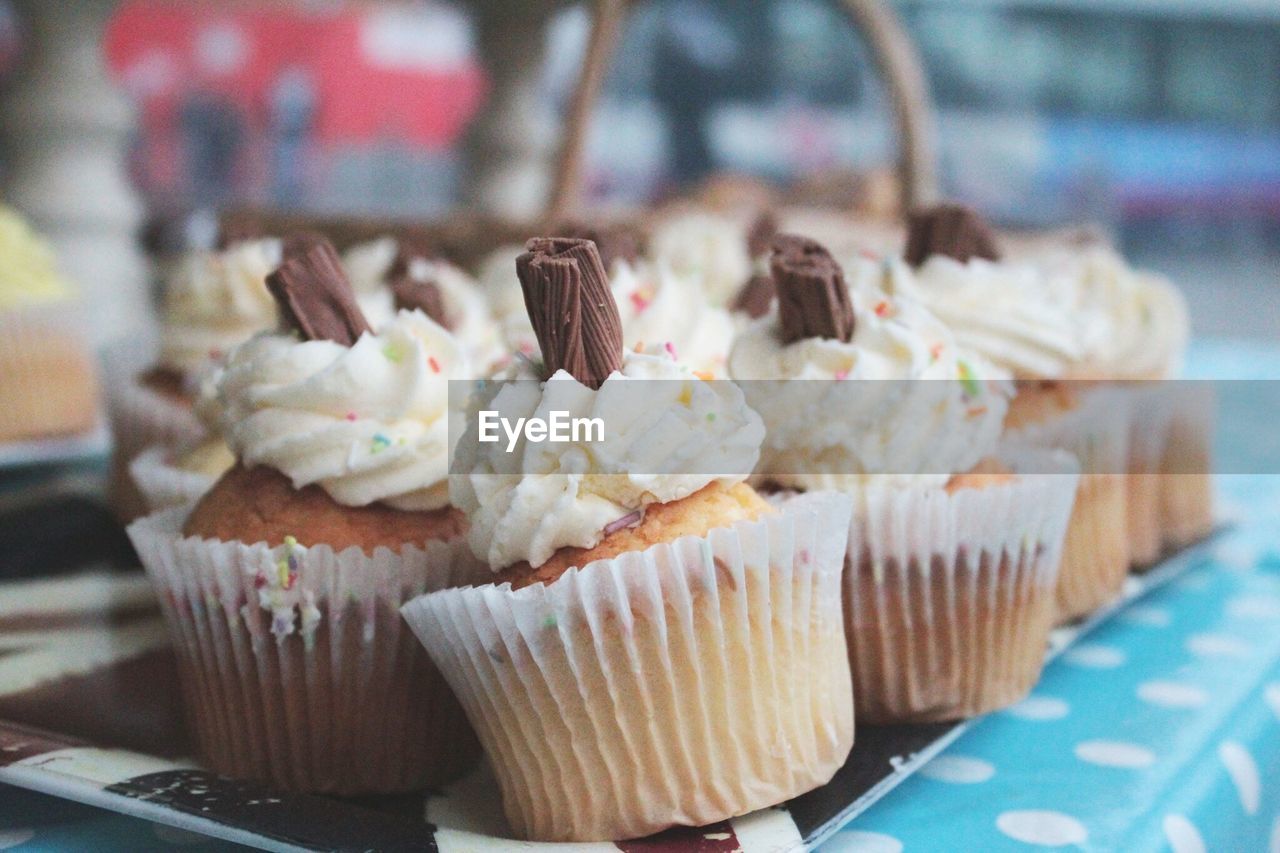 Close-up of cupcakes for sale in bakery