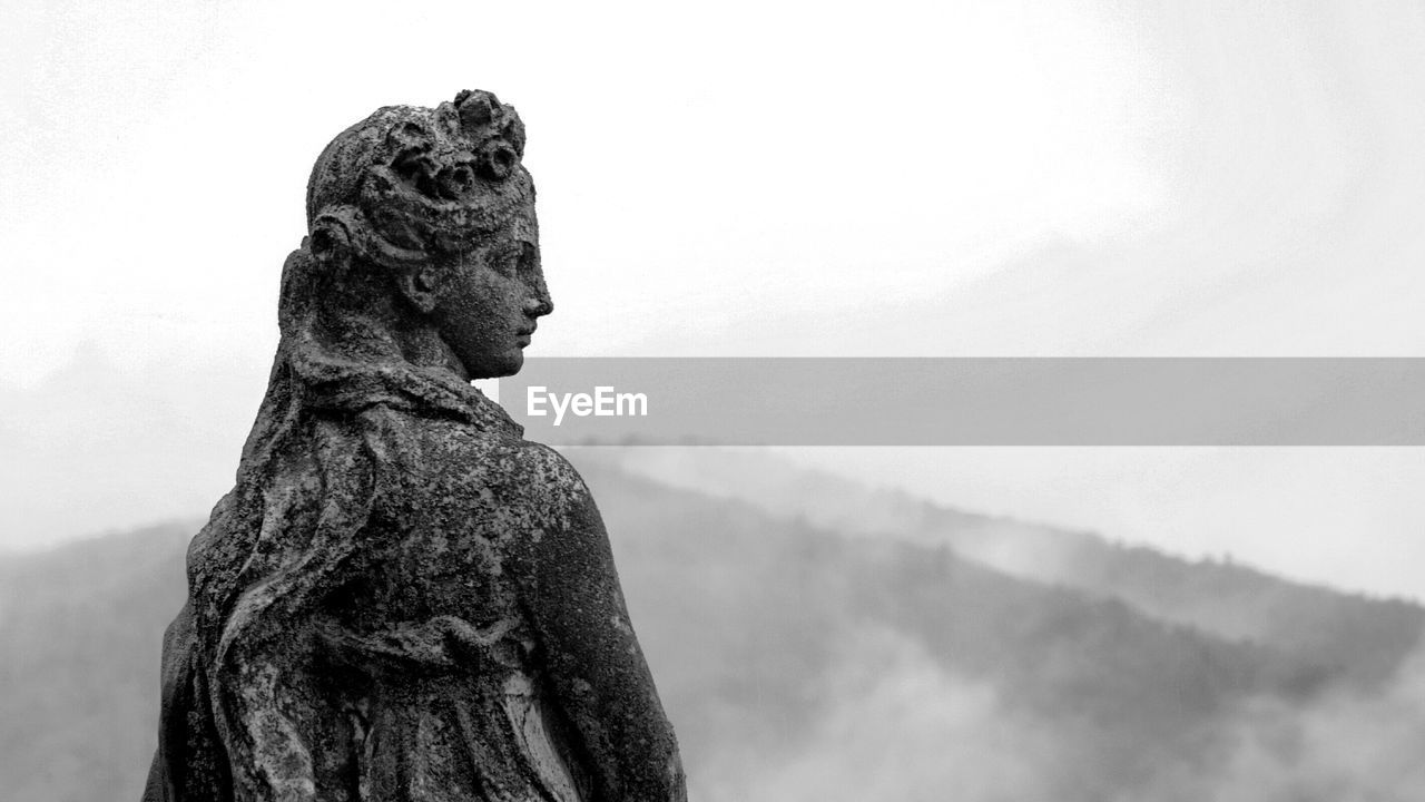 Low angle view of statue against sky