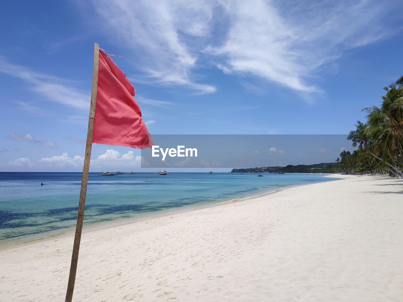 UMBRELLA ON BEACH AGAINST SKY