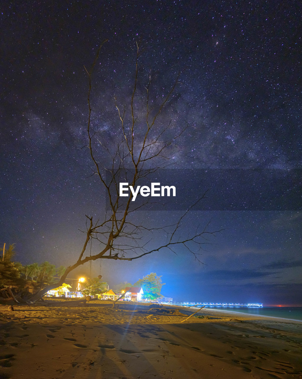 scenic view of sea against blue sky at night