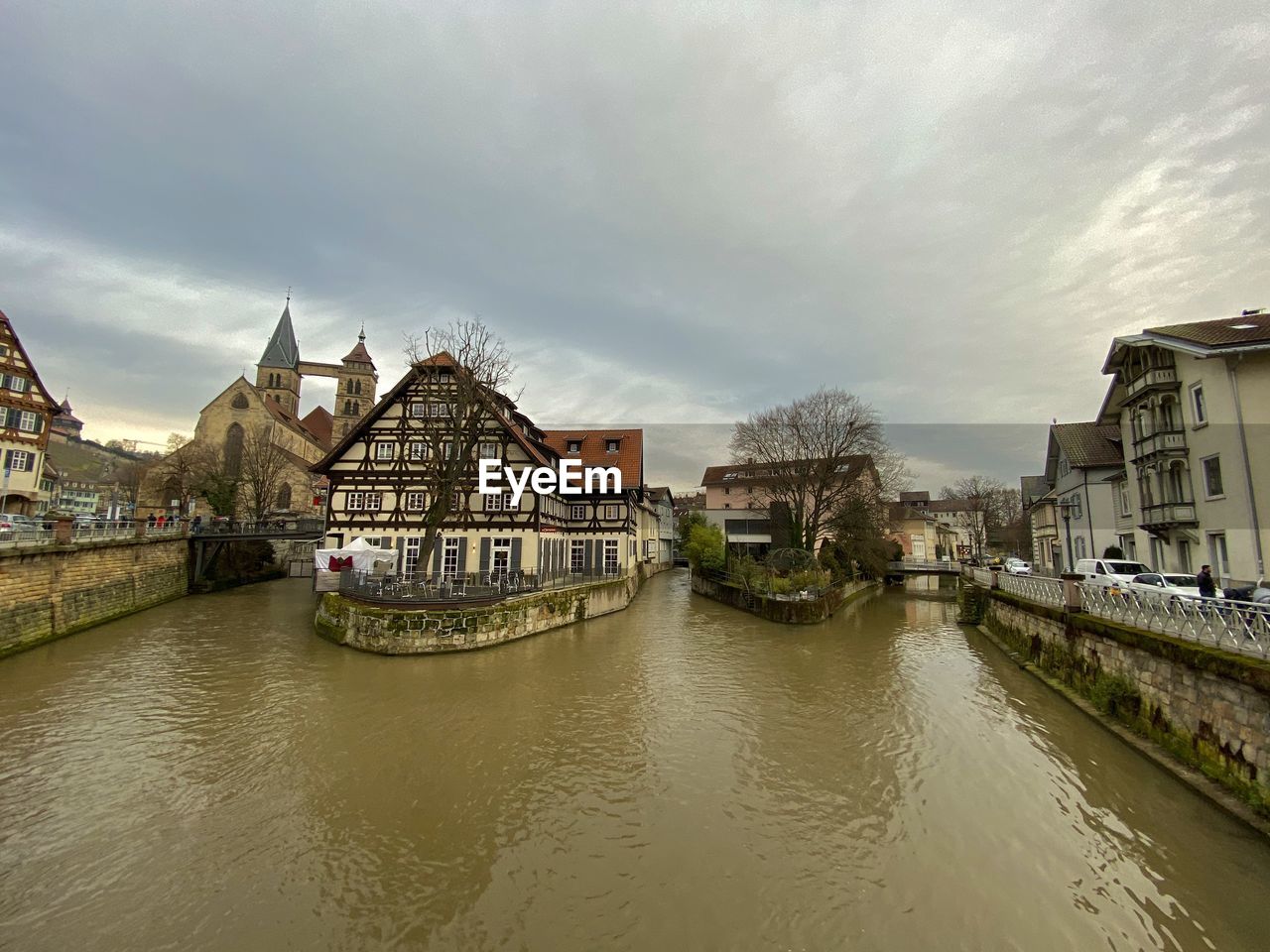 River amidst buildings against sky in city