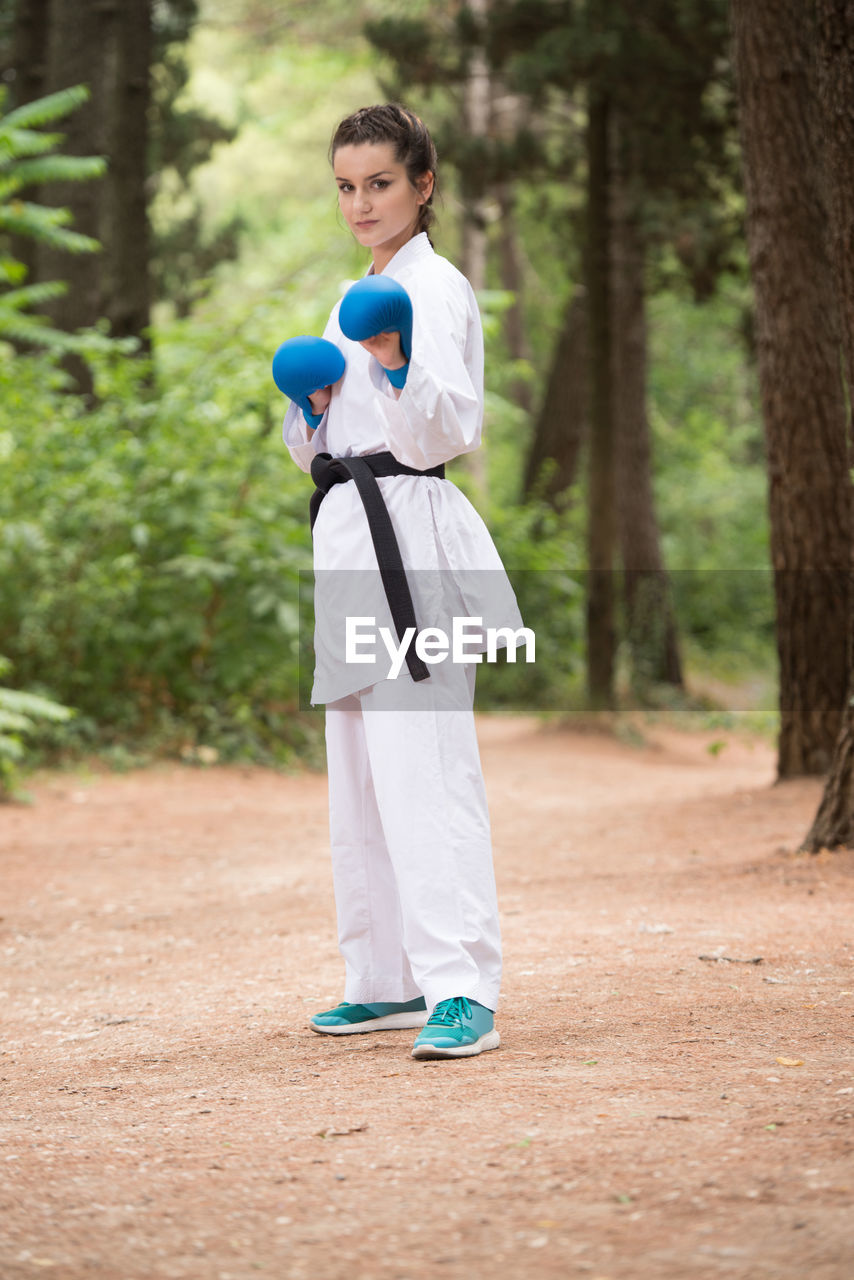 side view of woman standing on field