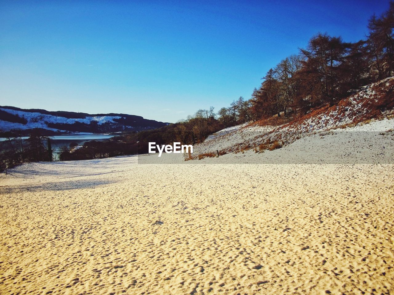 PANORAMIC VIEW OF LAND AGAINST CLEAR BLUE SKY