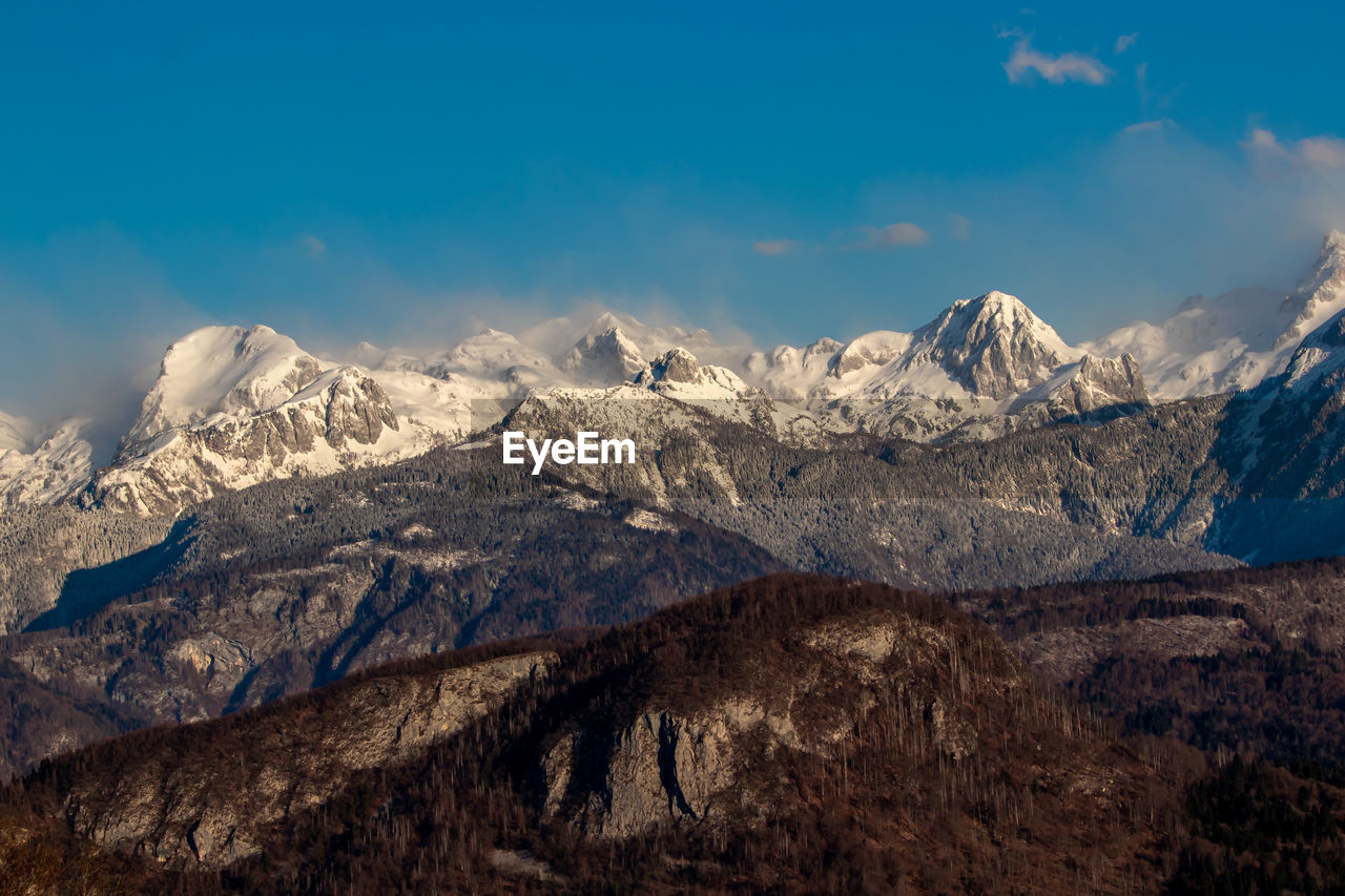 Scenic view of snowcapped mountains against sky