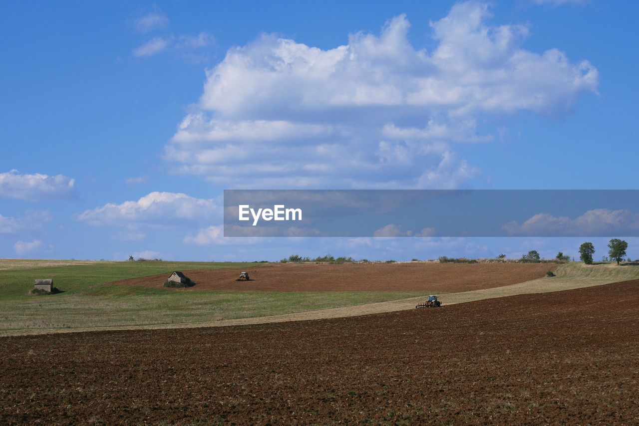 Scenic view of landscape against cloudy sky