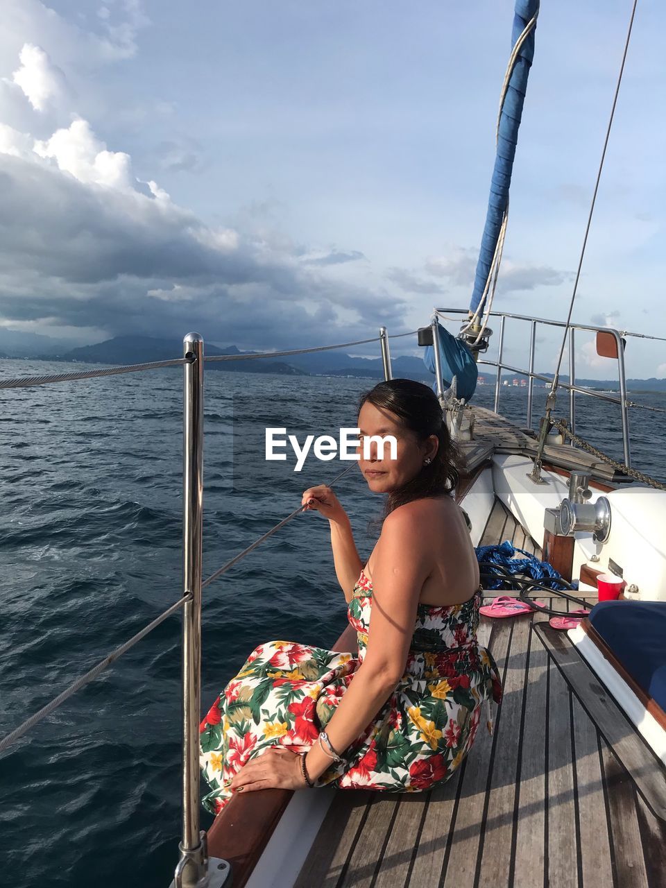 Portrait of woman sitting in boat on sea