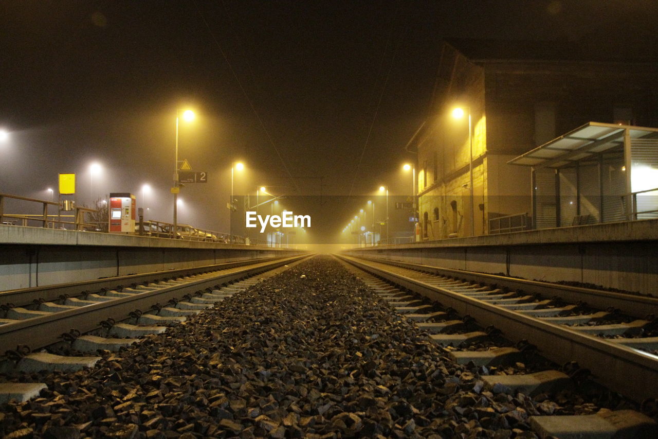 Illuminated railroad station at night