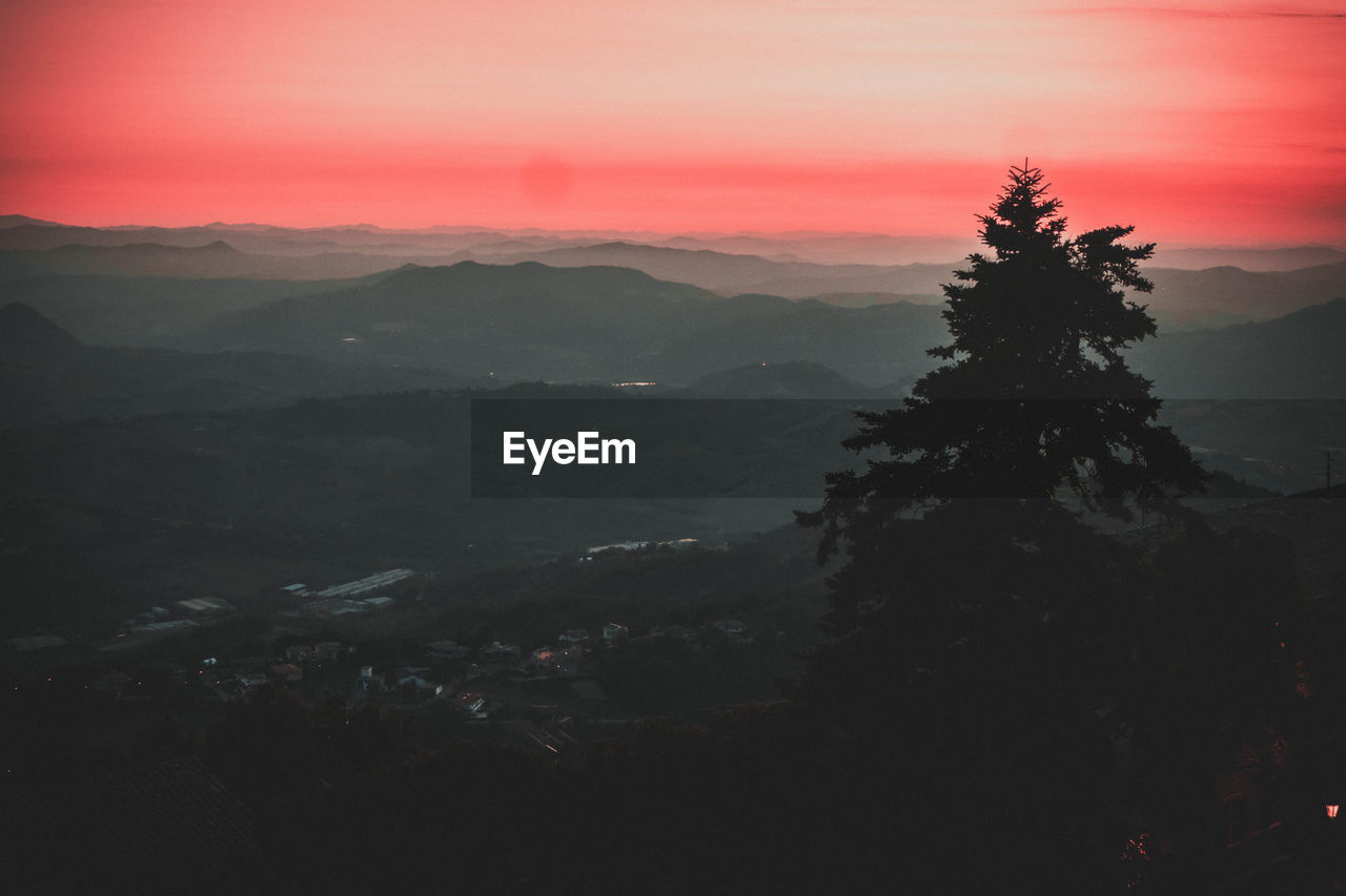 Scenic view of mountains against sky during sunset