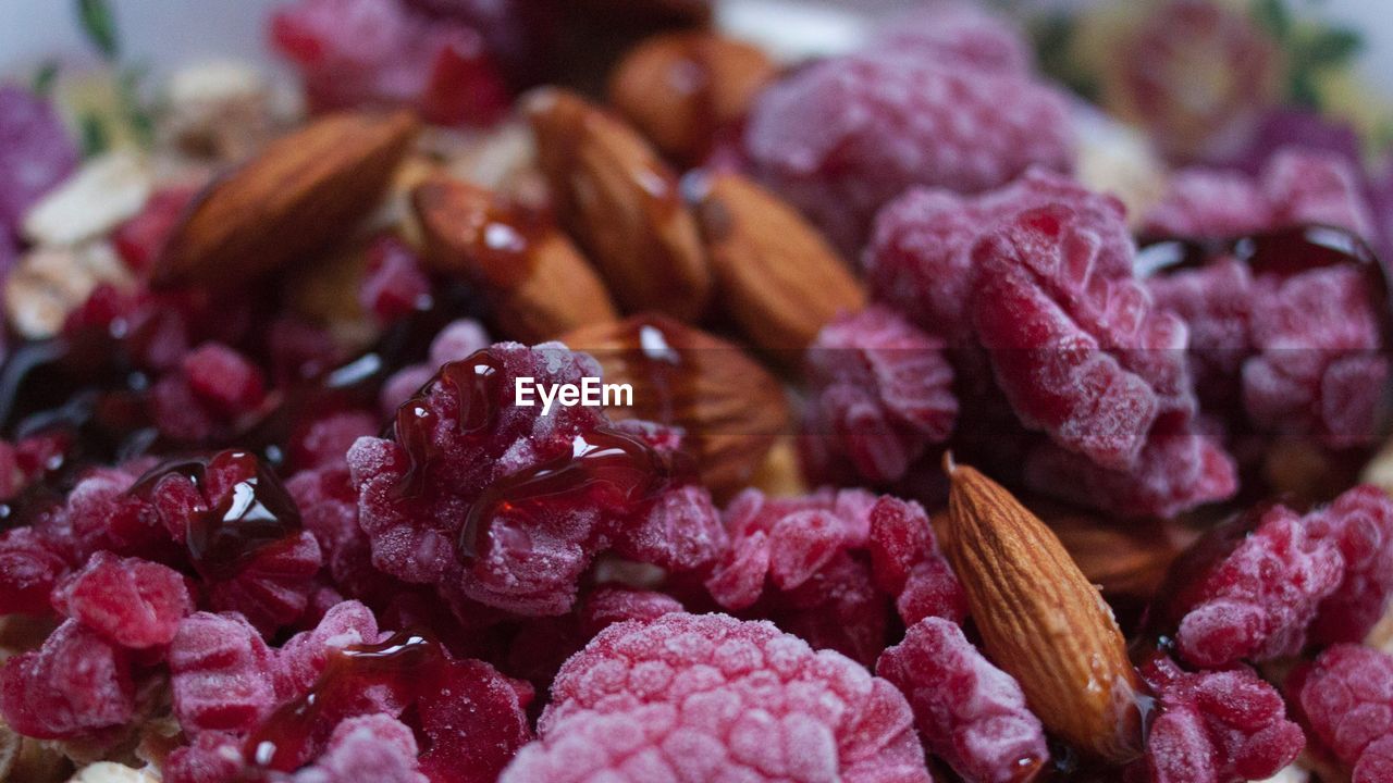 Full frame shot of raspberries with almonds