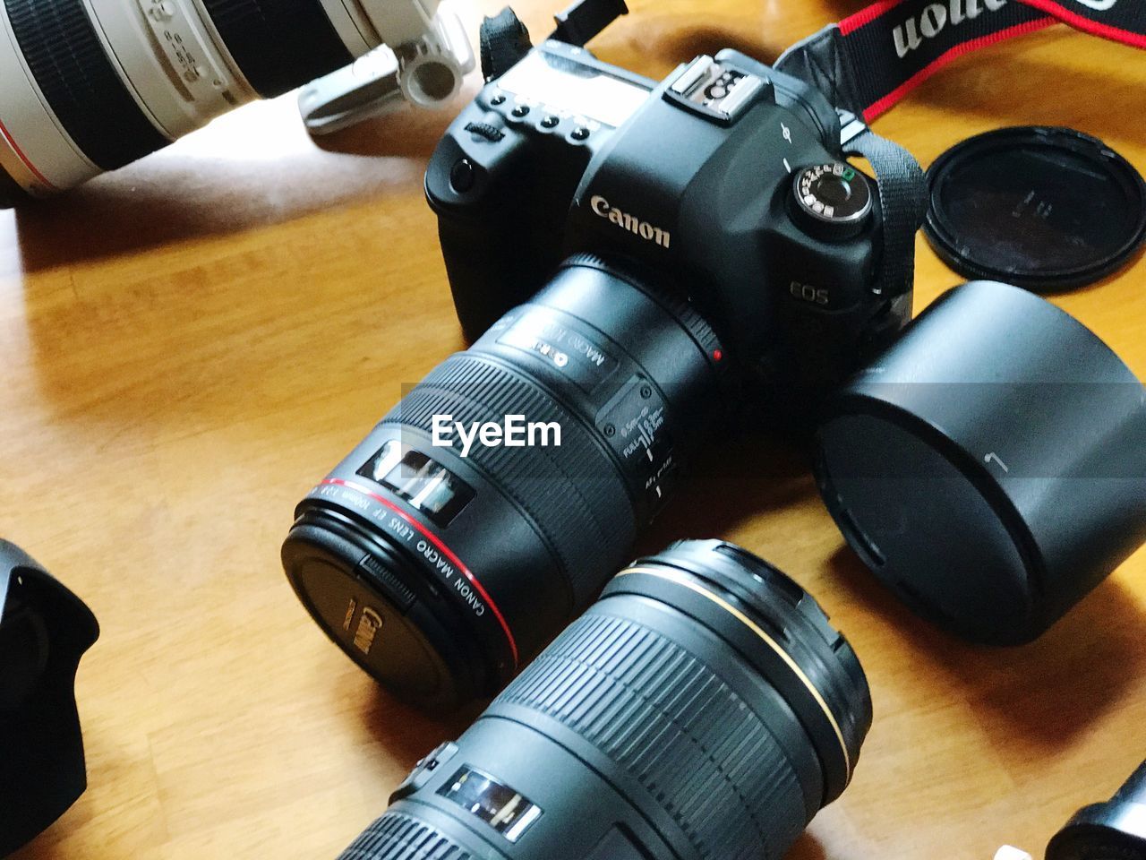 HIGH ANGLE VIEW OF CAMERA ON TABLE AT HOME