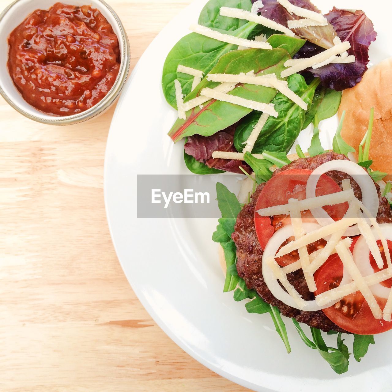 Close-up of burger served with sauce on plate