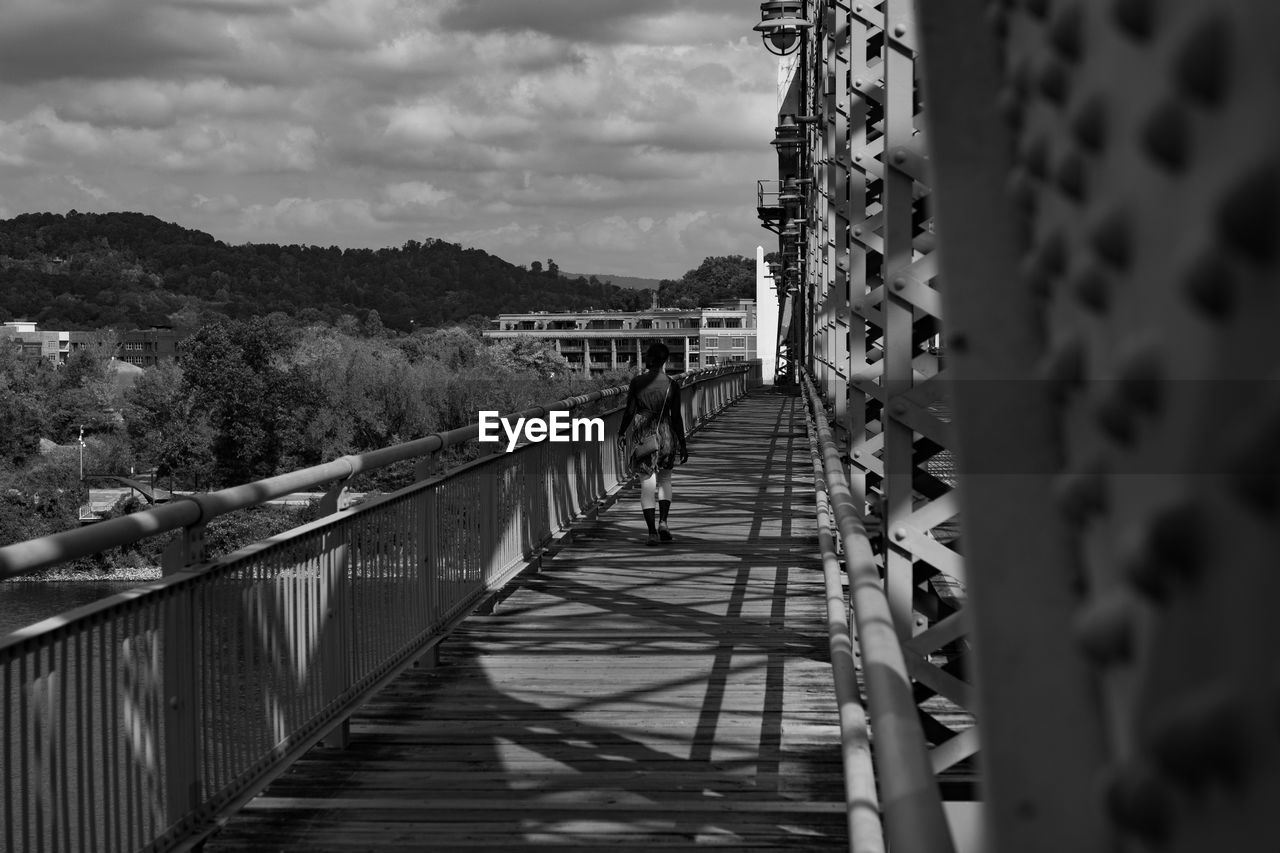 Footbridge against sky