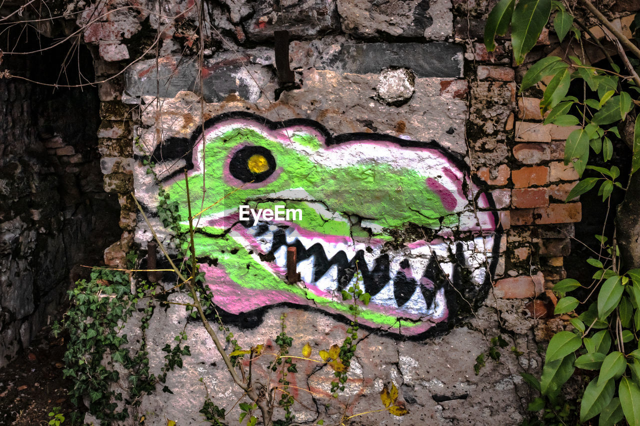 GRAFFITI ON STONE WALL