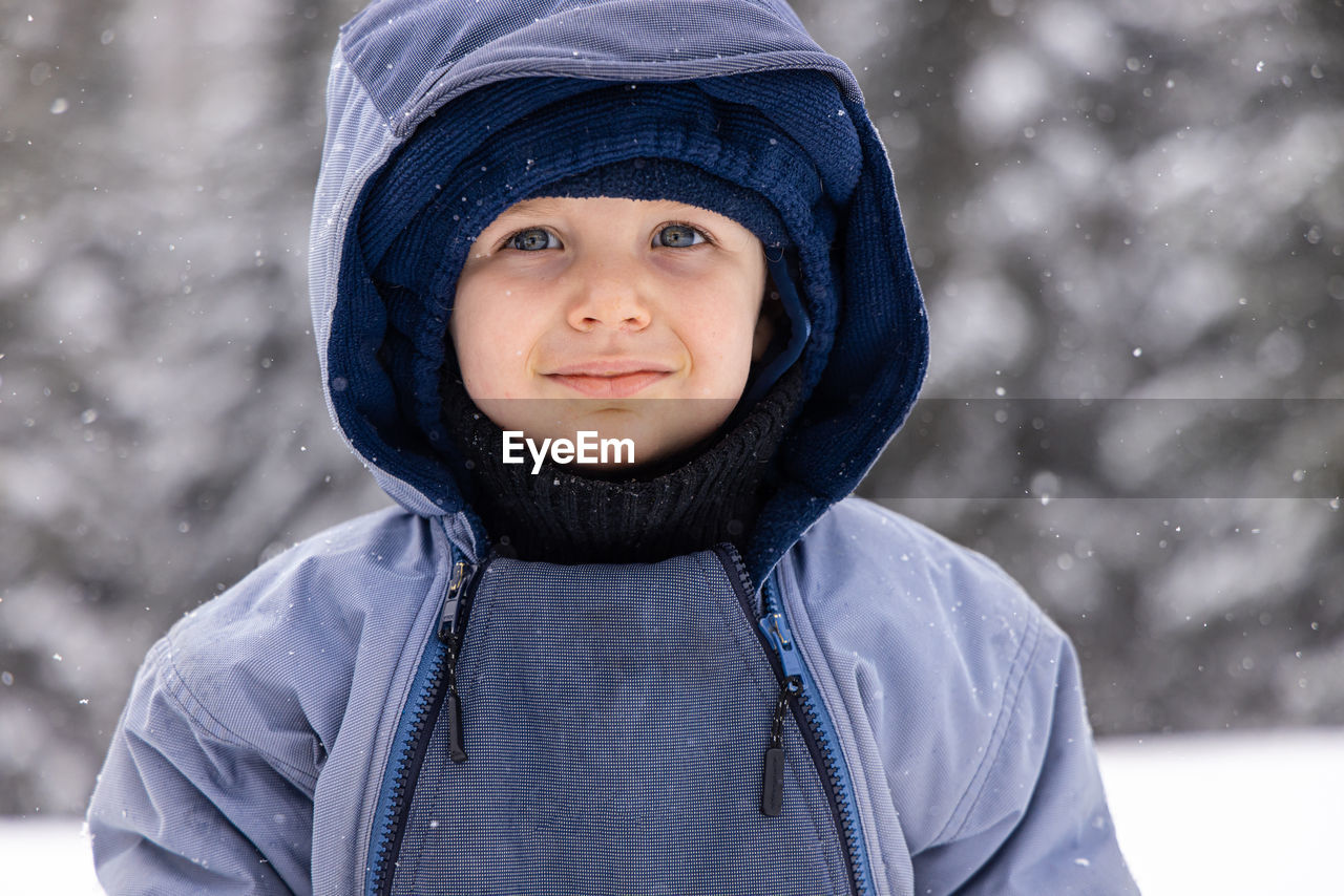 portrait of smiling young woman in warm clothing