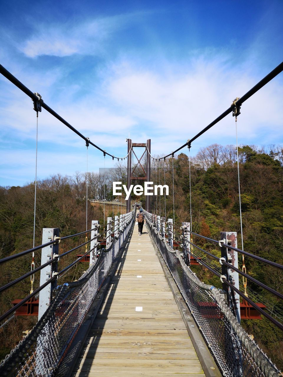 bridge, sky, the way forward, nature, architecture, suspension bridge, built structure, cloud, railing, footbridge, transportation, rope bridge, diminishing perspective, day, landscape, travel destinations, footpath, outdoors, rope, no people, land, travel, scenics - nature, transport, tree, tourism, vanishing point, tranquility, environment, water, beauty in nature, wood, plant, mountain, tranquil scene, track, forest, holiday, cable, city, metal, walkway