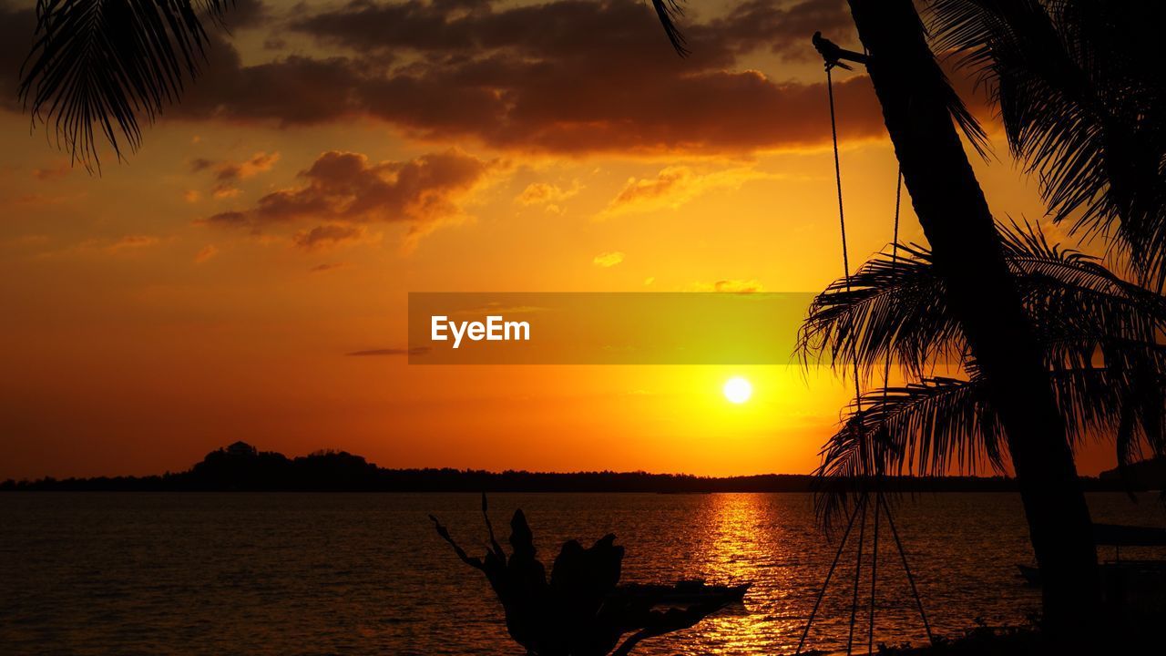 Silhouette of boat at sunset