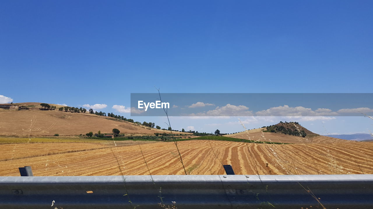 SCENIC VIEW OF FARM AGAINST SKY