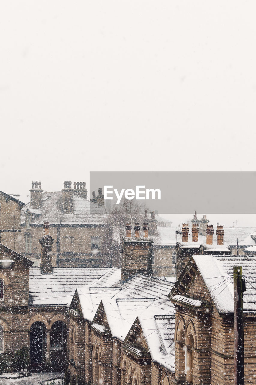 High angle view of houses during snowfall