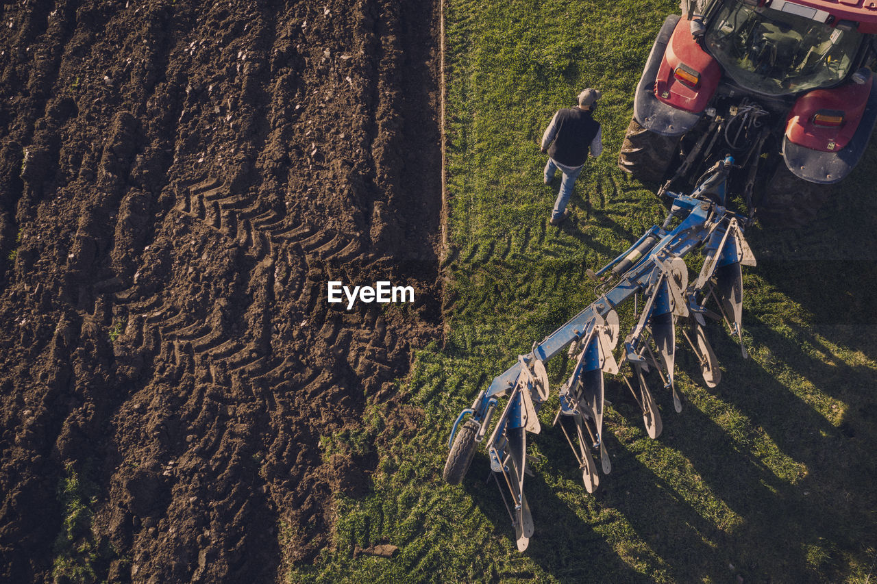 Tractor plowing field