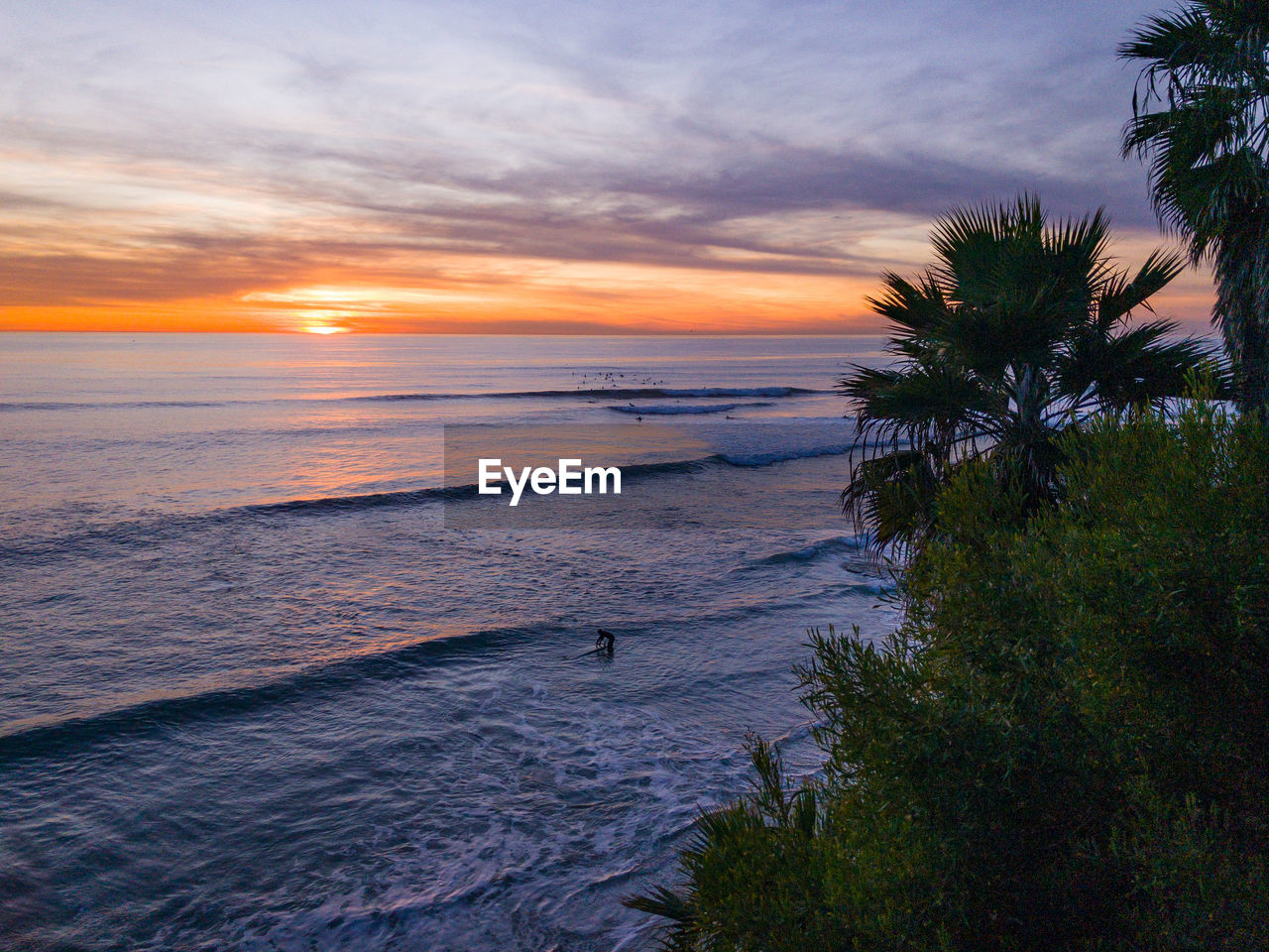 Scenic view of beach and ocean at sunset