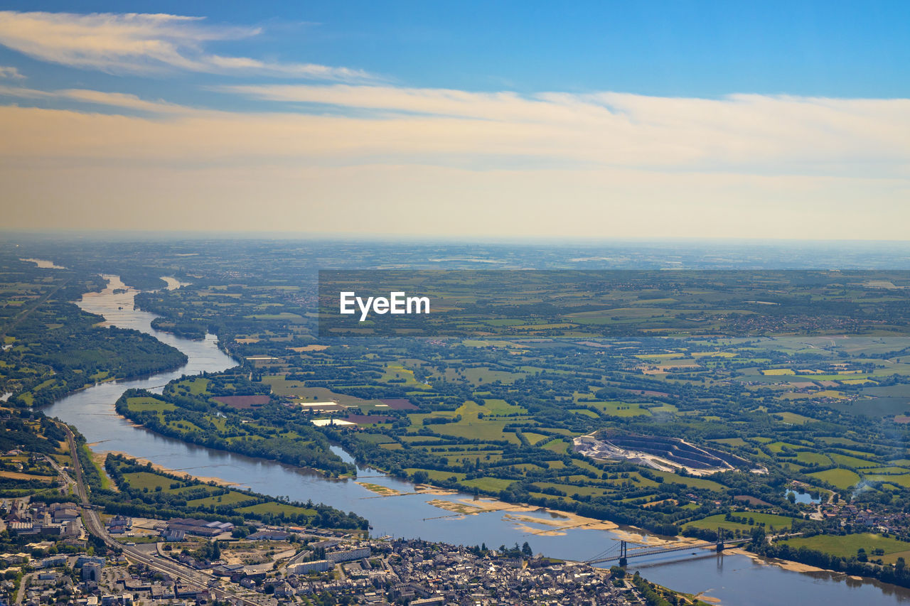 AERIAL VIEW OF RIVER AMIDST CITY