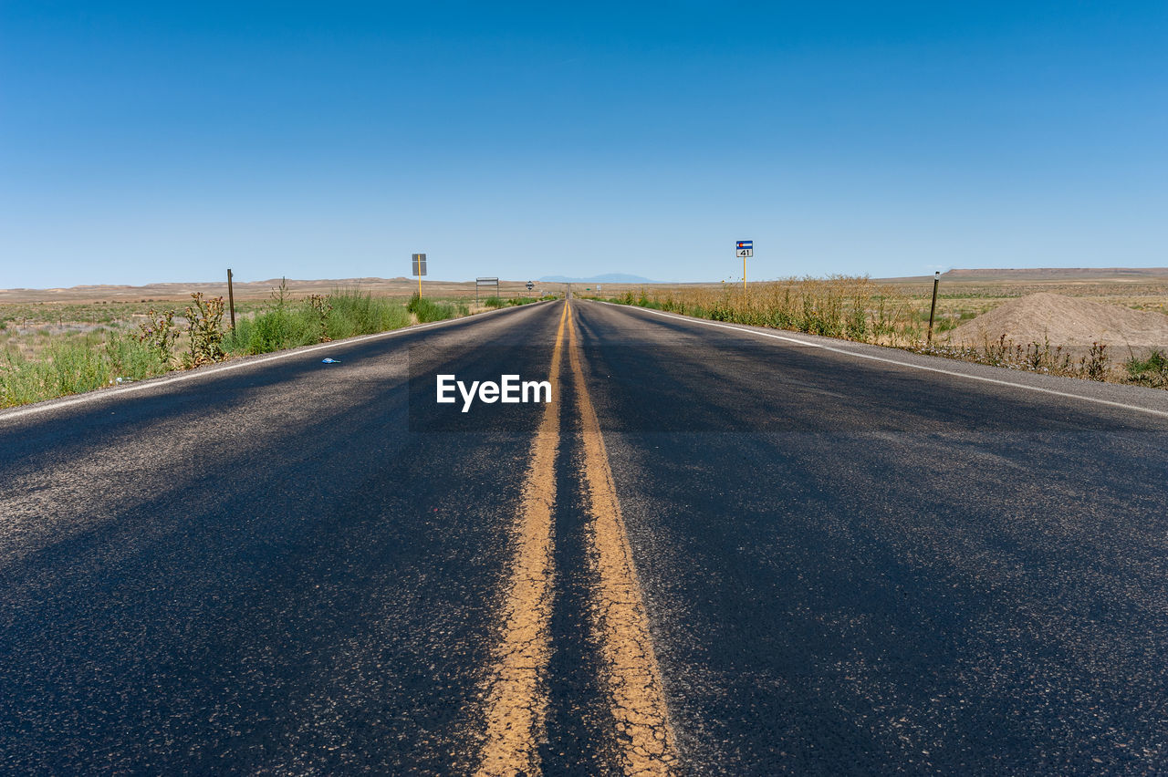 EMPTY ROAD AGAINST SKY