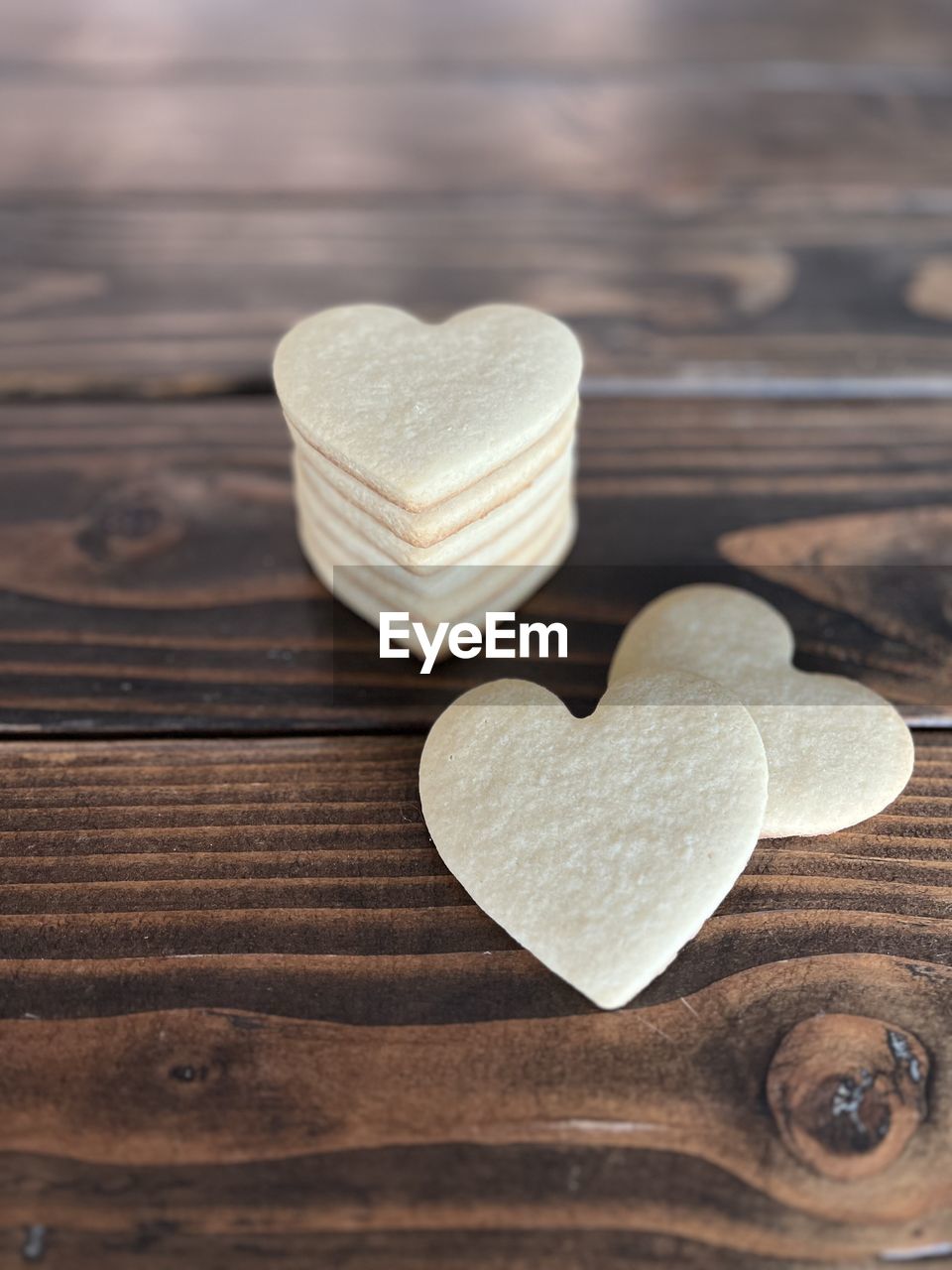 heart shape, love, positive emotion, emotion, wood, heart, valentine's day, romance, food and drink, food, indoors, still life, table, close-up, cookie, sweet food, togetherness, copy space, high angle view, freshness, petal, simplicity, shape