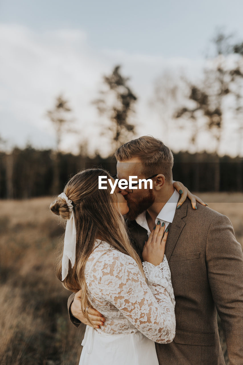 Bride and groom kissing