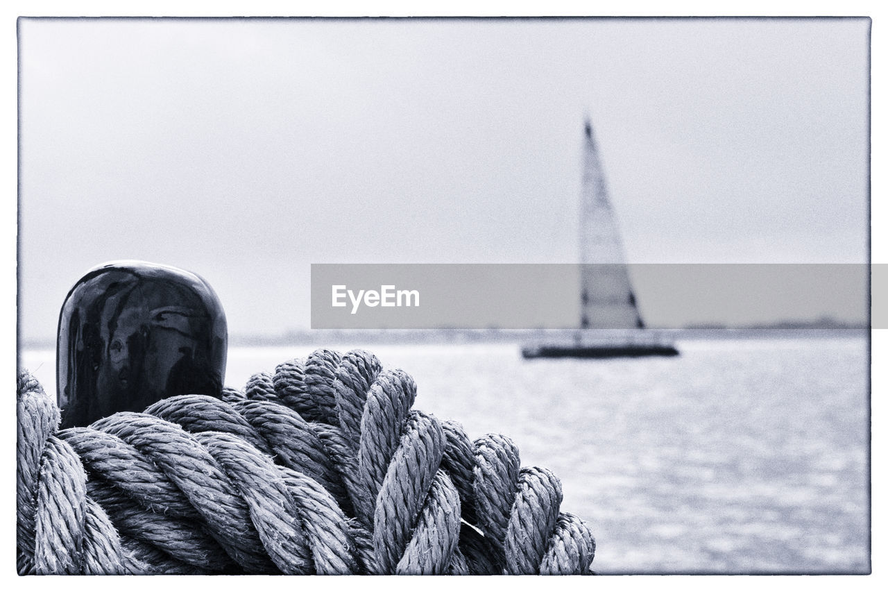 CLOSE-UP OF SAILBOAT AT HARBOR