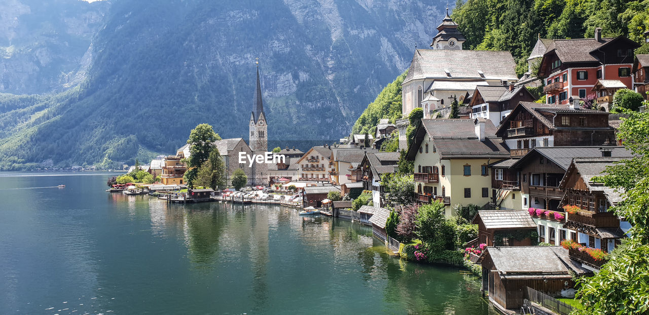 Buildings by river in town