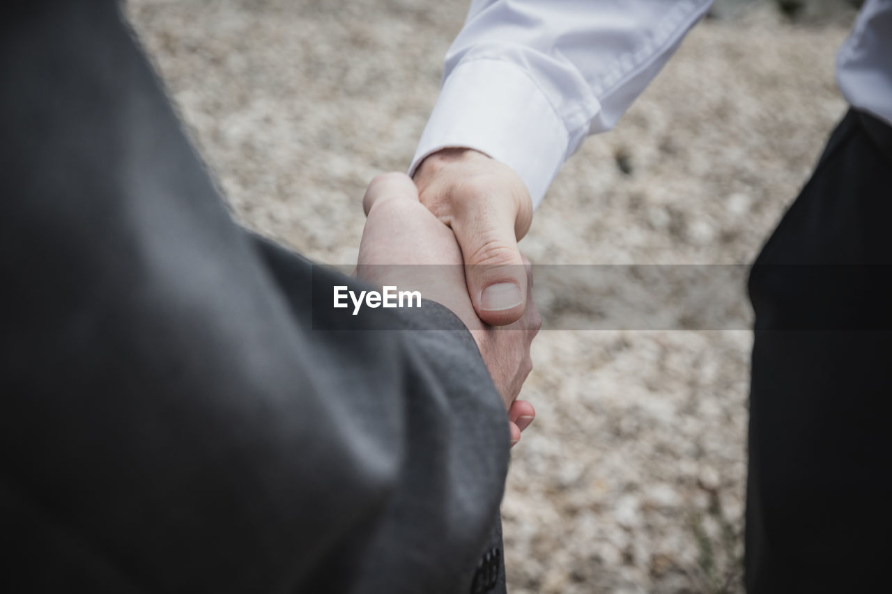 Cropped image of businessman doing handshake