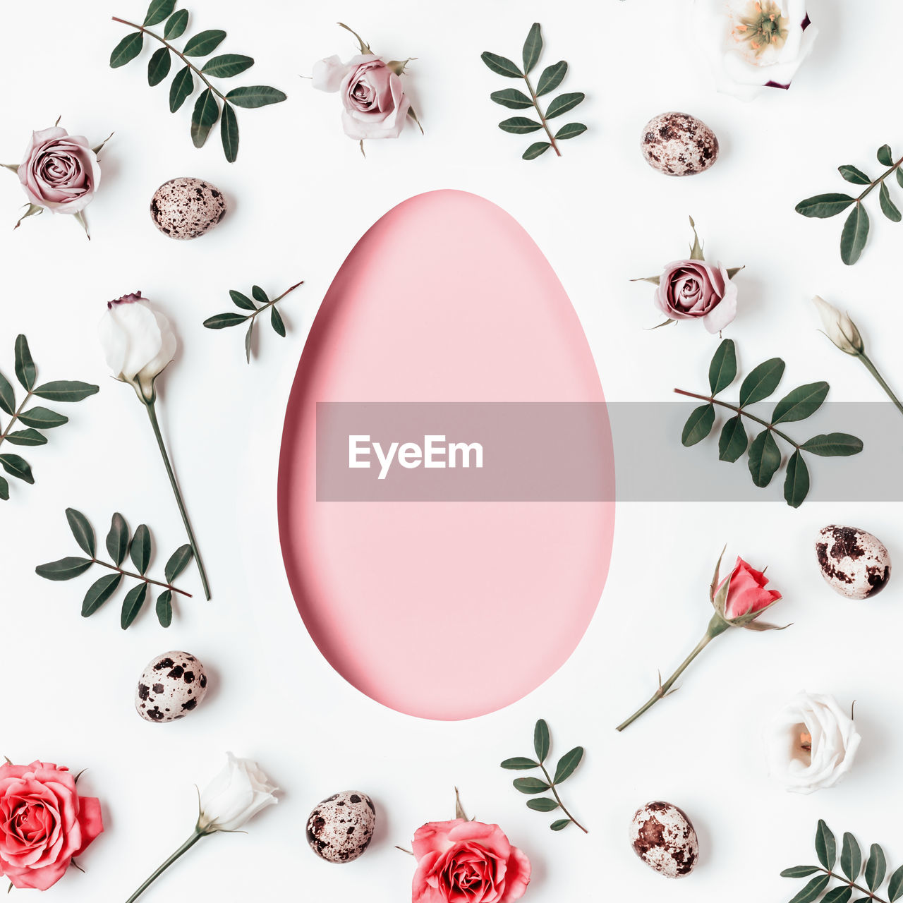 Creative layout egg made of pink flowers and green leaves. happy easter card.