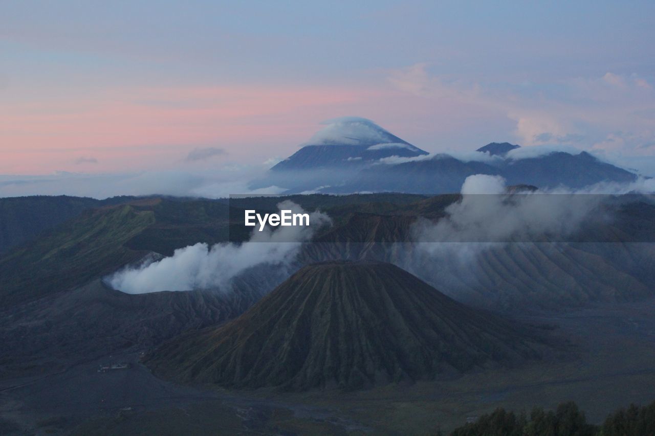 Panoramic view of volcanic landscape against sky during sunset