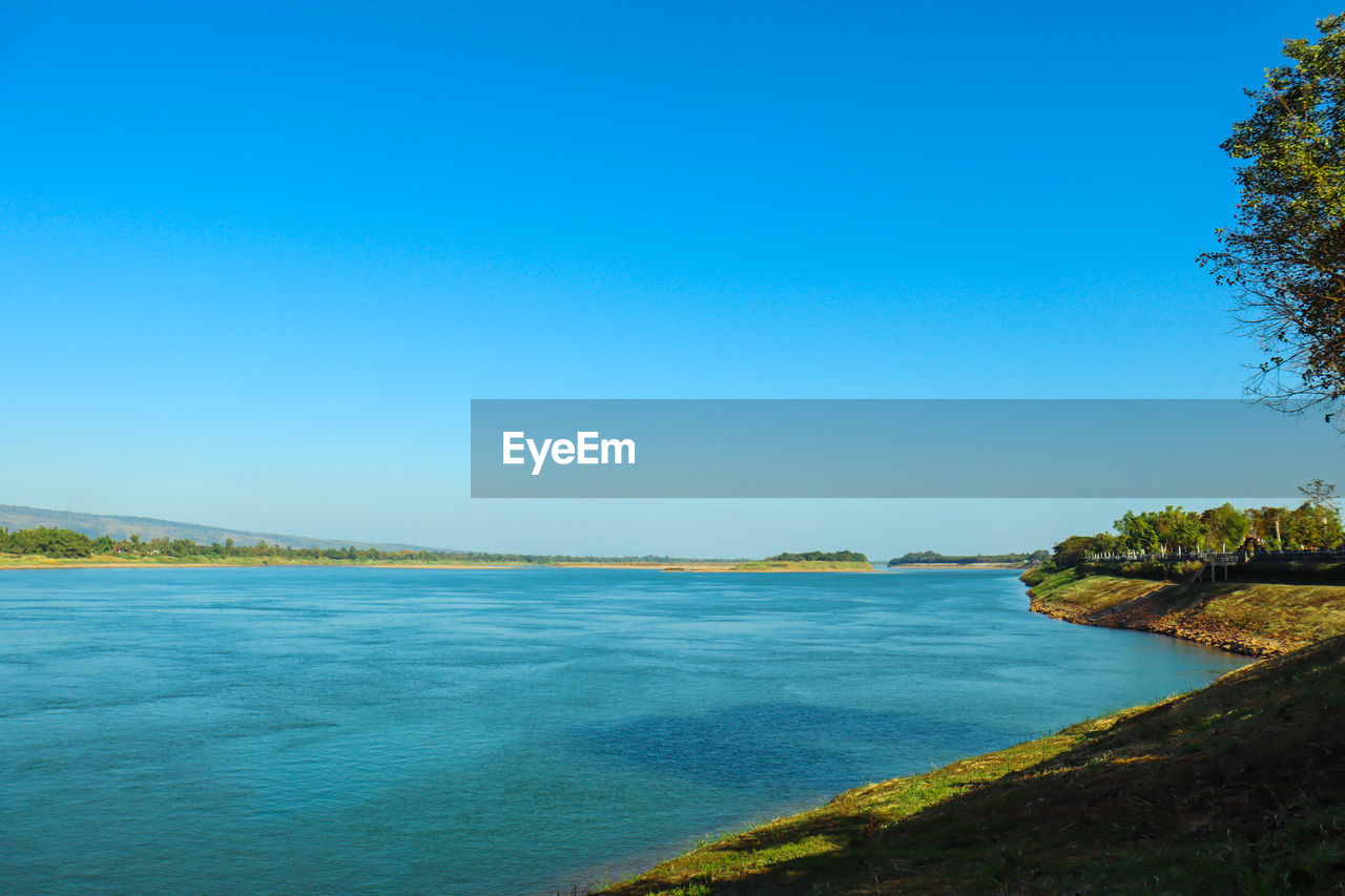 SCENIC VIEW OF SEA AGAINST BLUE SKY