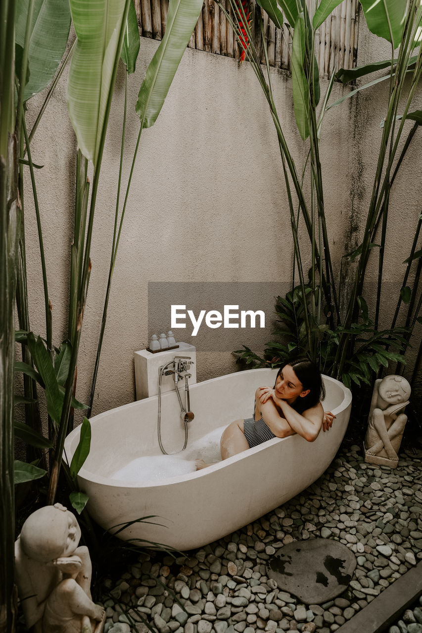 high angle view of woman in bathtub