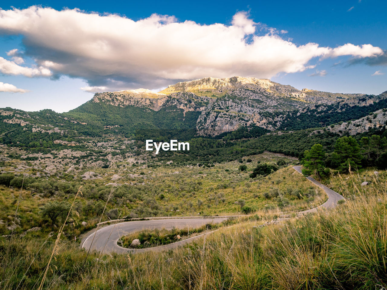 SCENIC VIEW OF MOUNTAIN AGAINST SKY