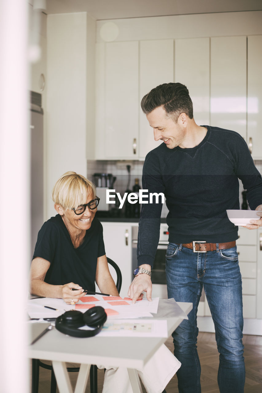 Man and woman having fun working from home