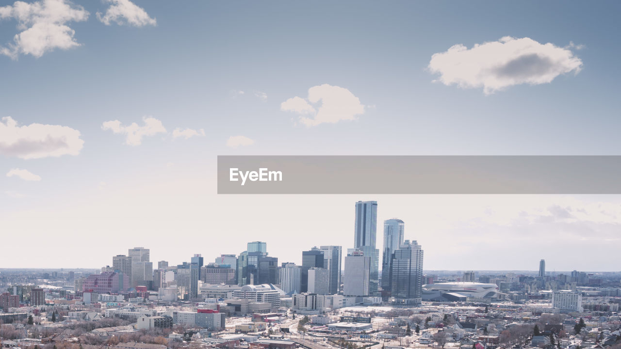 Modern buildings in city against sky