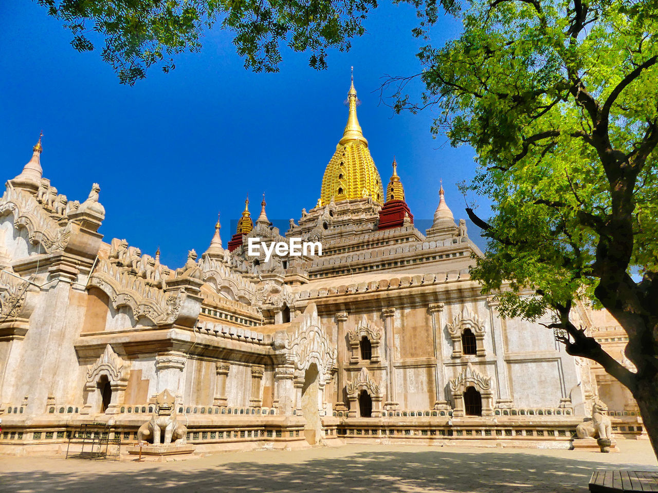 Exterior of temple against clear blue sky