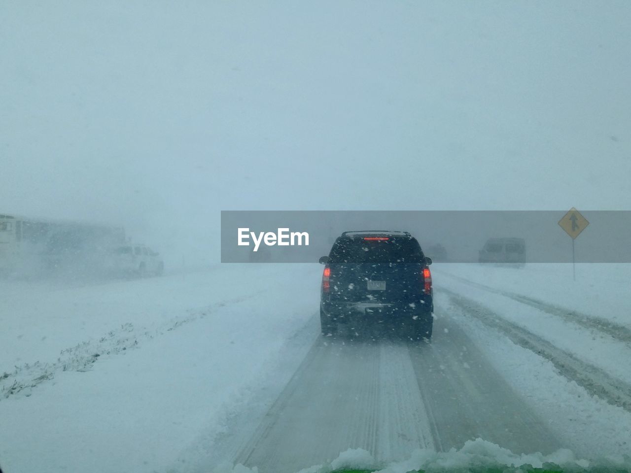 SNOW COVERED ROAD IN WINTER