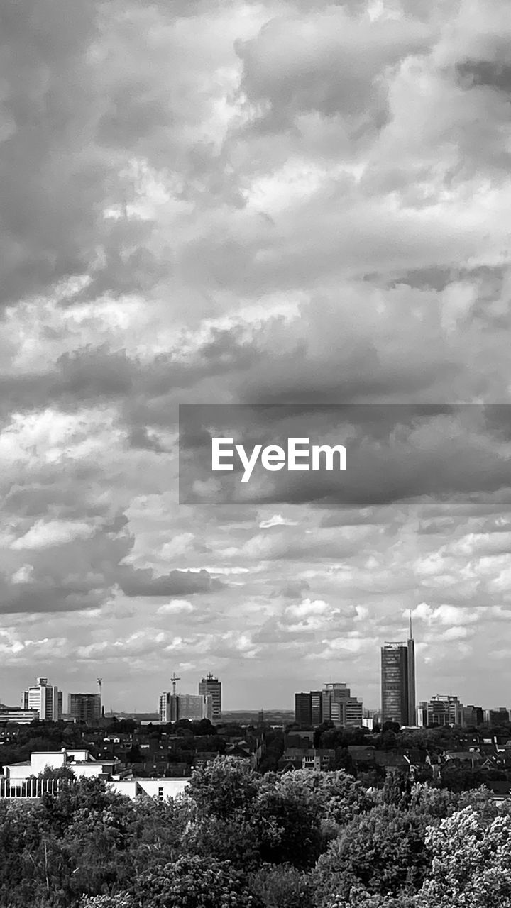 CITY BUILDINGS AGAINST SKY