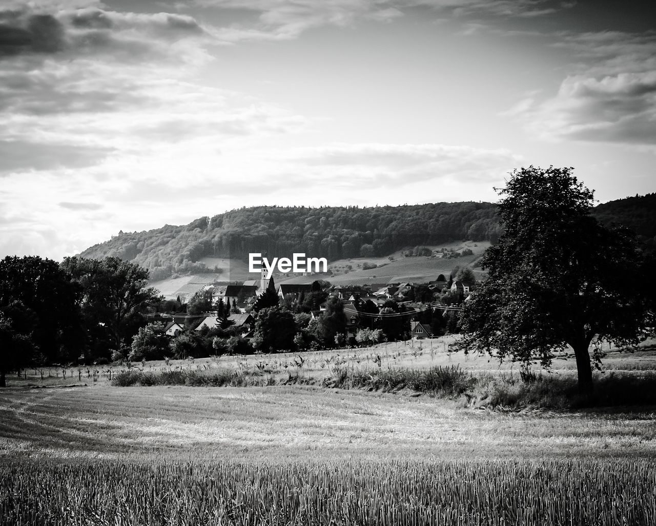 SCENIC VIEW OF MOUNTAINS AGAINST CLOUDY SKY